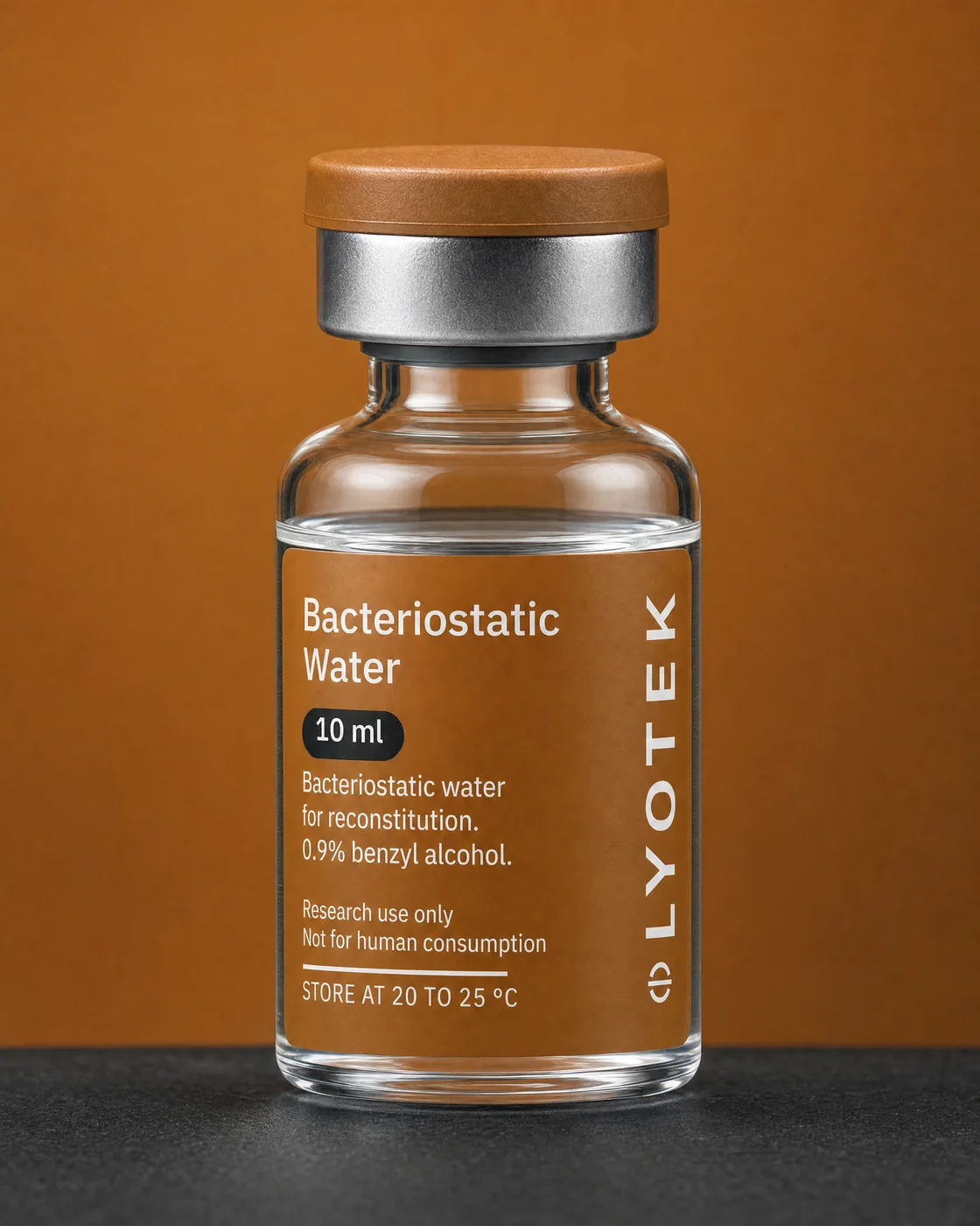 Bacteriostatic Water 10 ml in its 10R vial, standing on a black plinth against a copper ground