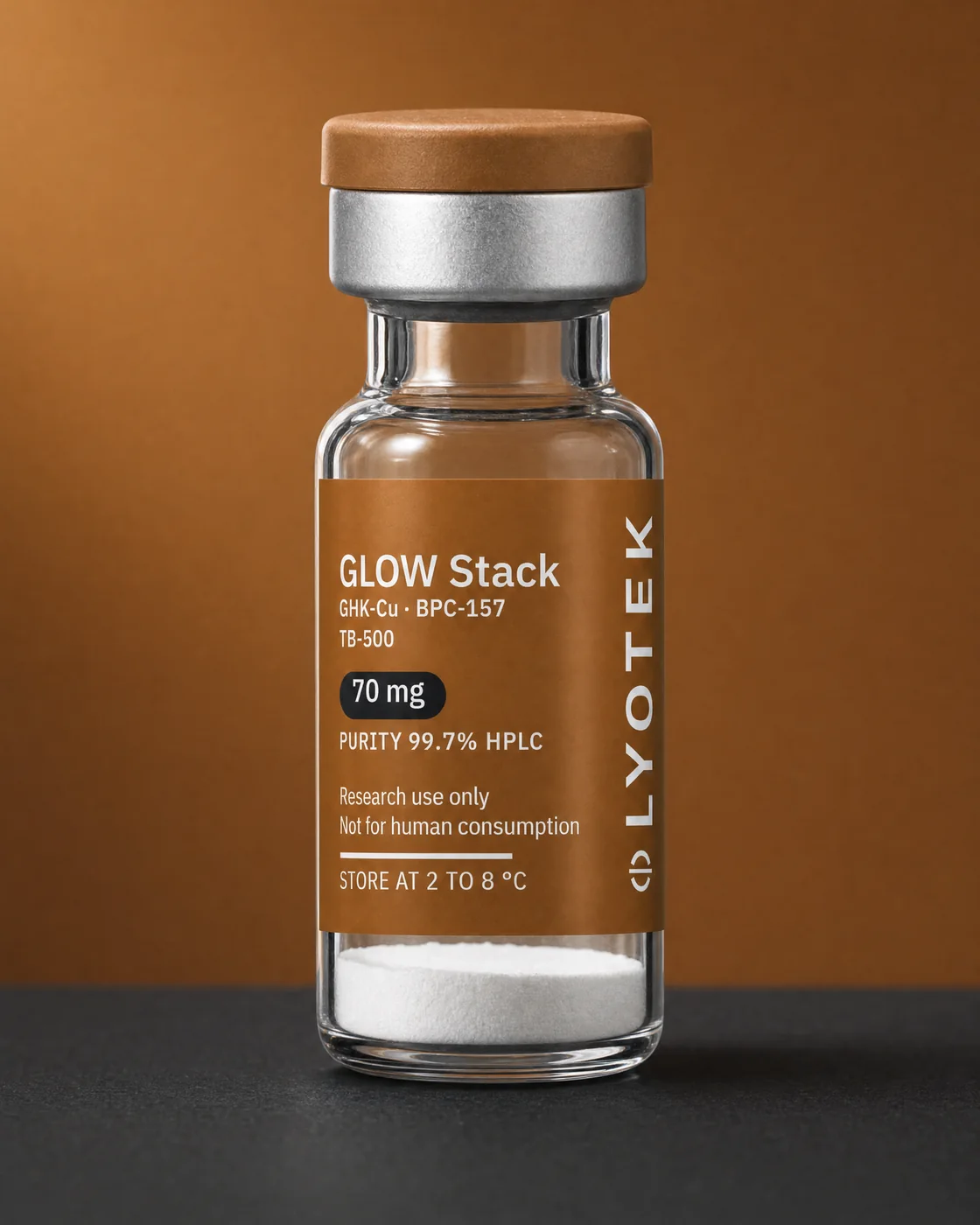 GLOW Stack 70 mg in its 2R vial, standing on a black plinth against a copper ground