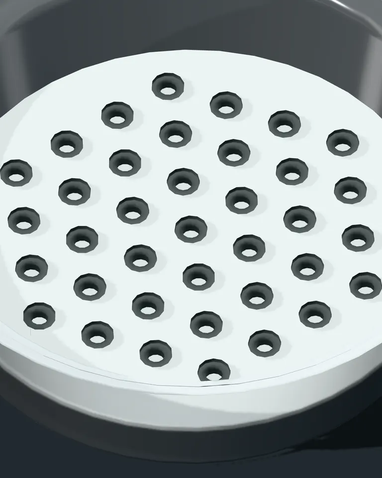 A moulded nest of grey butyl stoppers seated in their pockets inside an open tub.